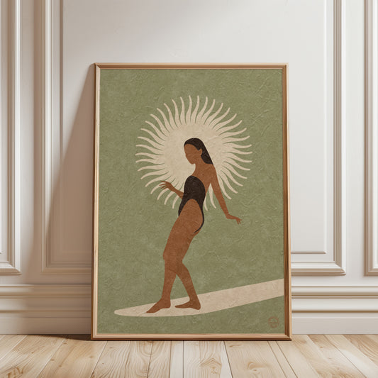 Framed artwork of a woman with a sunburst design on a green background in a room with paneling.