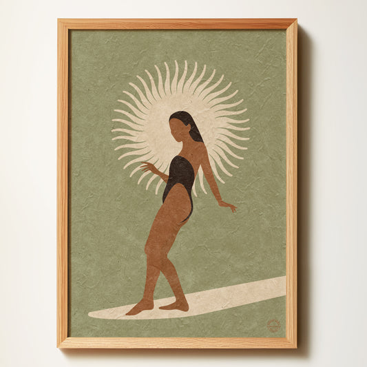 Framed artwork of a woman on a surfboard with a sun-like design, on a green background.