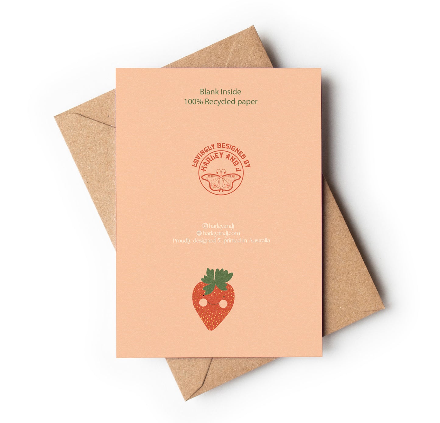 Back of Recycled paper card with strawberry design and brown envelope on white background