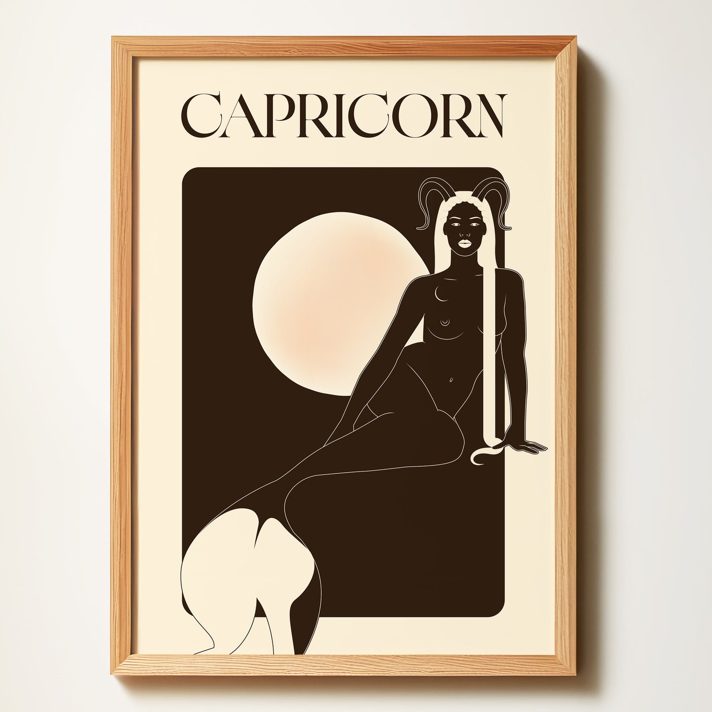 Framed artwork of a Capricorn zodiac sign with a silhouette of a person against a beige background.