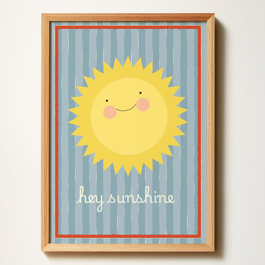 Framed artwork with a smiling sun and 'hey sunshine' text on a striped background.
