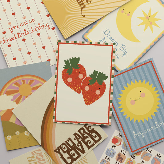 Collection of colorful greeting cards with various designs on a light gray background