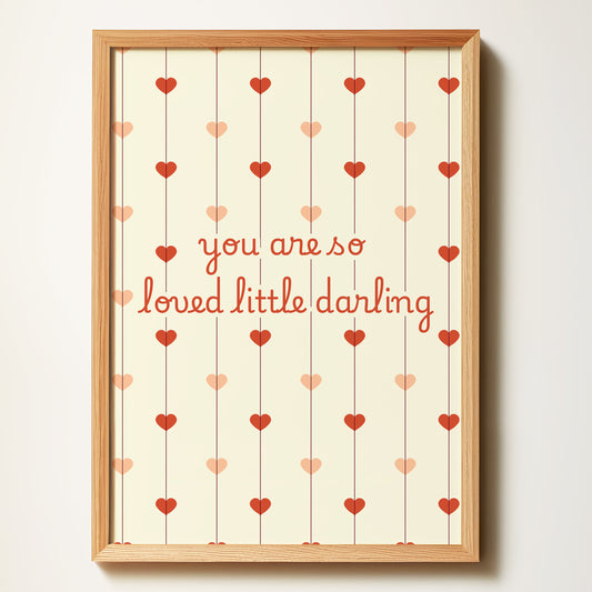 Framed print with 'you are so loved little darling' text and heart patterns on a beige background