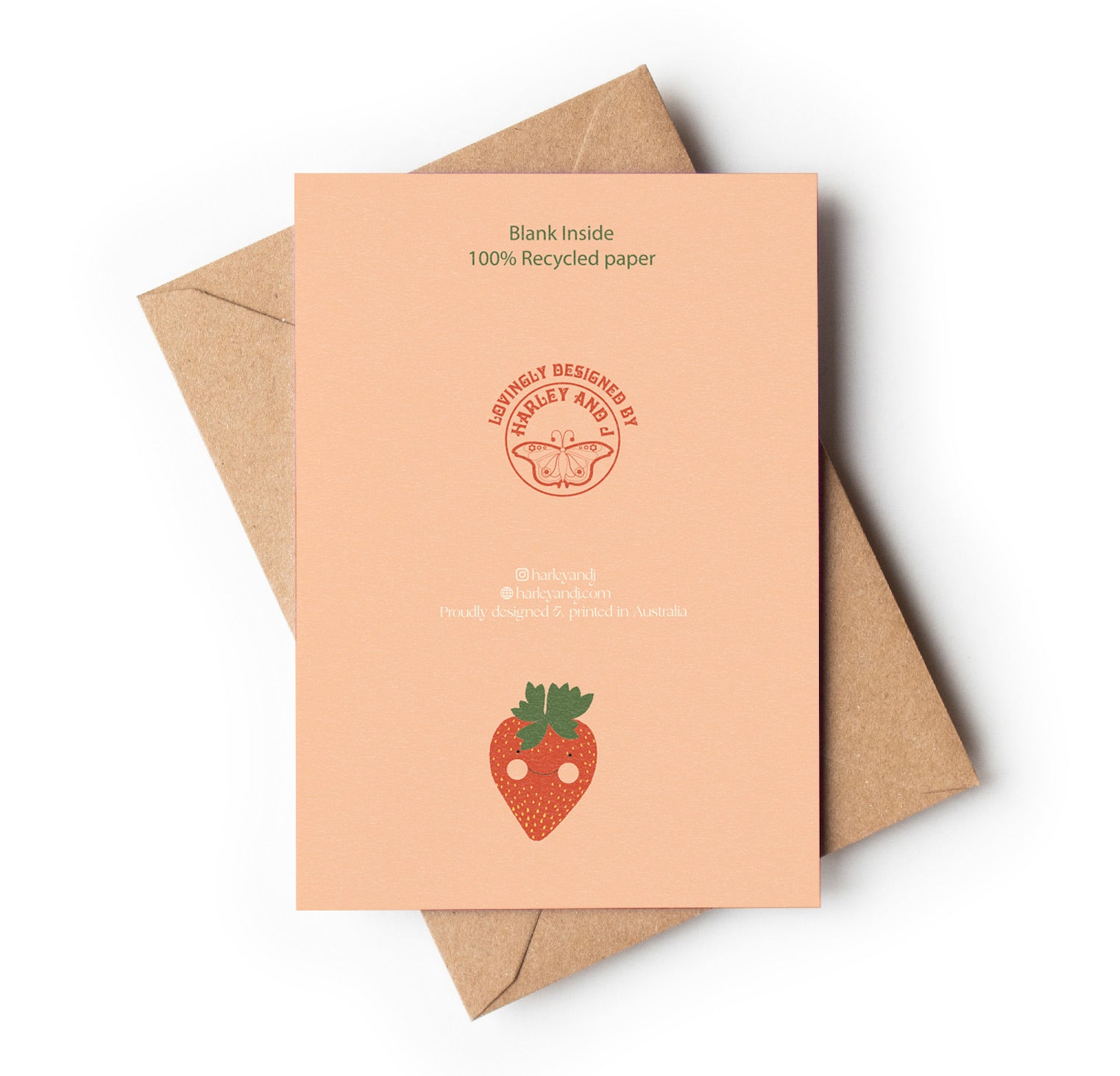 Back of Recycled paper card with strawberry design and brown envelope on white background