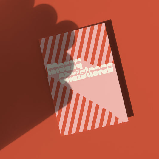 Red and pink Greeting card with 'Merry Christmas' retro text on a red background