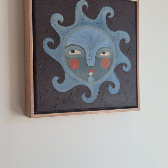 Video of sun face painting with blues and browns