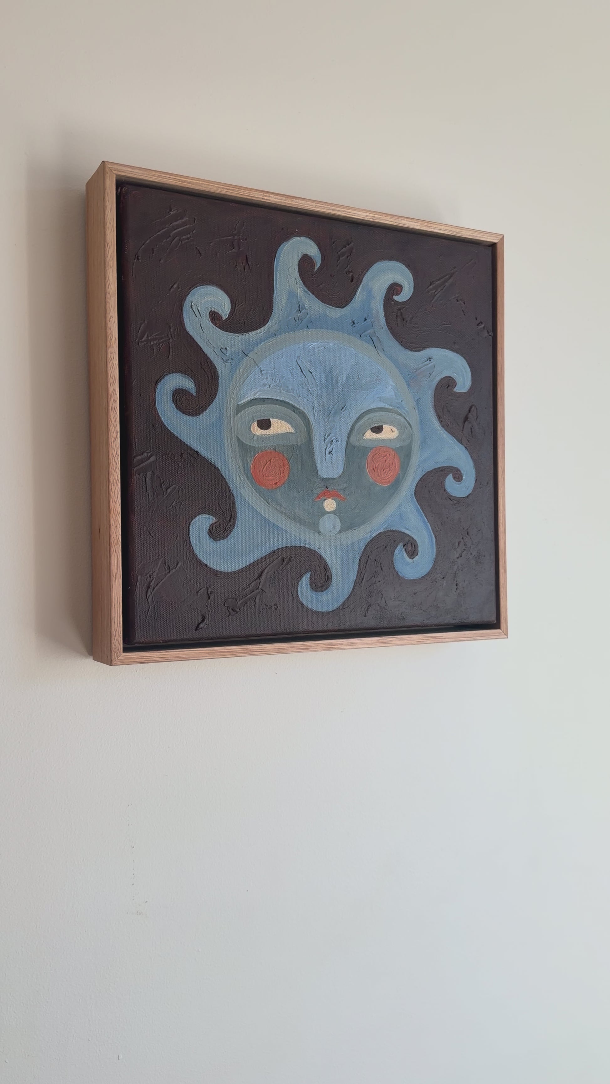 Video of sun face painting with blues and browns