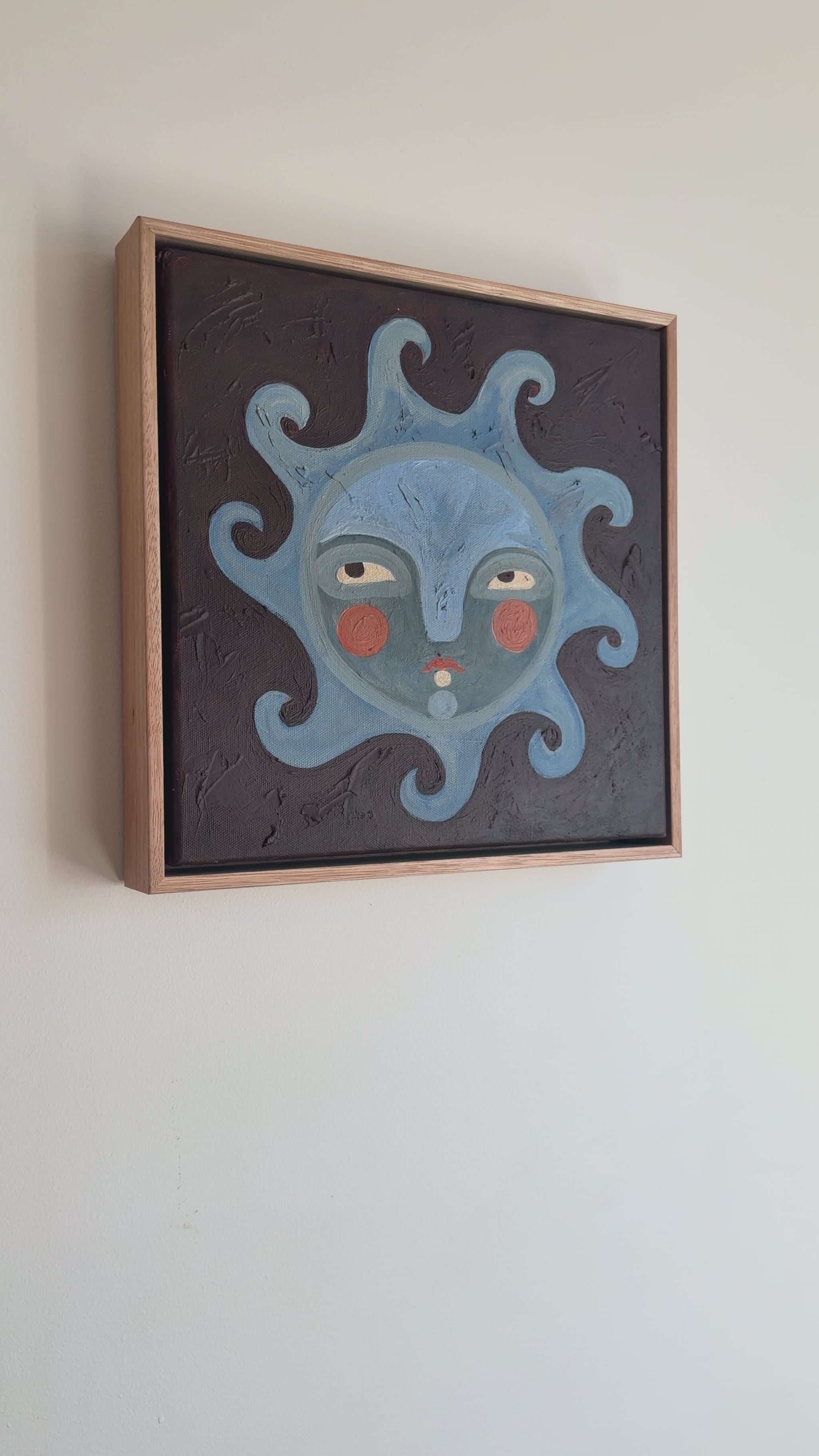 Video of sun face painting with blues and browns